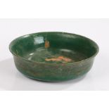 Green glaze dish, the glaze with a line decoration to the interior and the exterior with hatched