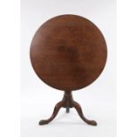 George III mahogany occasional table, the circular tilt top above a turned column and cabriole legs,