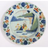 18th Century Delft plate, polychrome painted with an Oriental figure and lake scene, 23cm diameter