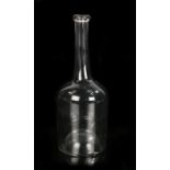 Late 18th Century glass bottle, with a slender neck above the mallet body, 24.5cm high