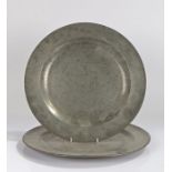 Two pewter chargers, the first stamped Edgar & Son , 38cm wide, the second with no makers marks,