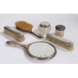 Silver handled dressing table set, consisting of hand mirror, hair brush and two clothes brushes,