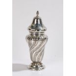 Silver sugar castor, marks rubbed, the flame form finial above a pierced top section, the bulbous