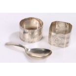 Two silver napkin rings, silver caddy spoon, 3oz (3)