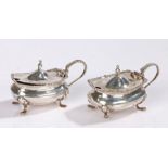 Pair of Continental silver mustard pots and covers, with acanthus leaf capped handles and