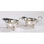 Pair of George VI silver sauceboats, Birmingham 1939, maker Asprey & Co Ltd, with double scroll