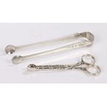 Pair of Irish silver sugar tongs, marks rubbed, with shell form terminals and harebell decorated