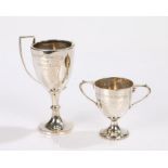 Two silver trophy cups, one with handle missing, 2.7oz