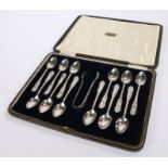 Set of twelve silver plated teaspoons and matching sugar tongs, maker Joshua Maxfield of