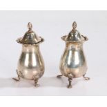 Pair of Edward VII silver pepperettes, Birmingham 1902, makers marks rubbed, with swirl cast