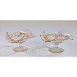 Pair of Victorian glass bon bon dishes, each with frilled rims and gilt floral decoration, raised on