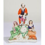 19th Century Staffordshire clock group, modelled as William Shakespeare standing over a clock face
