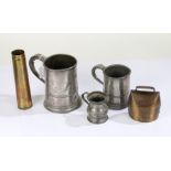 Two 19th Century pewter tankards and a measure, a French brass cow bell and a brass shell case dated