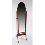 20th Century walnut cheval mirror, having shaped top and bevel glass plate mirror, raised on splayed