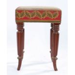 William IV style mahogany stool, the needlework seat raised on four deeply gadrooned legs, 33cm wide