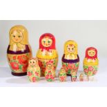 Graduating set of Russian Babushka dolls, with typical painted decoration, the tallest 24cm
