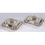 Pair of J & Co silver plated entree dishes and covers, the detachable handles above foliate, shell