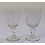 Pair of Victorian wine glasses, with ribbon tied and and floral garland etching, 16cm high (2)