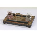 Victorian walnut desk stand, having twin glass inkwells either side of a gilt ormolu carrying handle