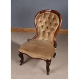 Victorian mahogany nursing chair, the arched button back above a stuff over seat and hipped cabriole