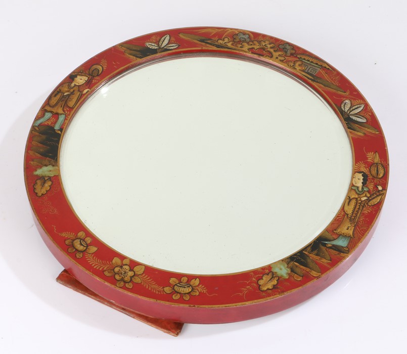 Chinese chinoiserie easel mirror, or circular form, decorated with figures and buildings on a red