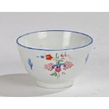 19th Century porcelain tea bowl, with blue painted rim and flowers to the sides, 8.5cm diameter