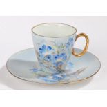 KPM porcelain coffee cup and saucer, hand painted with blue flowers and having gilt handle (2)