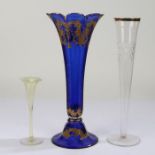 19th Century blue glass vase, having frilled rim and flared neck, the chamfered body with gilt