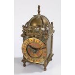 Smiths lantern clock, the brass case with bell to the pierced pediment, the dial with Roman