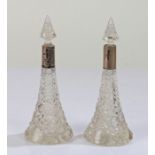 Pair of Edwardian glass scent bottles, each with silver collared necks, Birmingham 1907, and hobnail