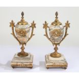 Pair of Victorian marble and gilt metal mounted garnitures, each with pineapple finials above