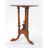 Victorian walnut and satinwood inlaid table, having circular moulded top centred with floral