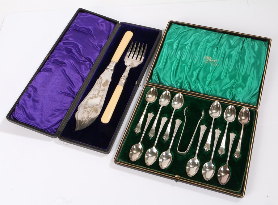 Set of twelve silver plated teaspoons and matching sugar tongs, with Albany pattern handles,