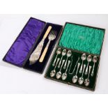 Set of twelve silver plated teaspoons and matching sugar tongs, with Albany pattern handles,