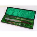 Early 20th Century horn handled three piece carving set, housed within a green velvet lined fitted