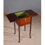 20th Century mahogany work table, having two part hinged lid enclosing a green fabric lined