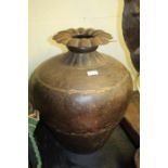 Middle Eastern pot, with gadrooned rim and bulbous tapering body, 50cm high