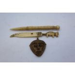 Bronze monkey head pendant,carved bone paper knife and needle (3)