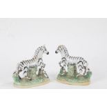 Pair of Staffordshire porcelain zebras, 12.5cm high, AF