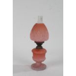 Glass oil lamp, in shades of pink with gadrooned and leaf design, 31cm high