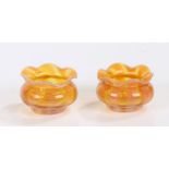 Pair of small Vaseline glass pots, with wavy orange edges above pink and orange bodies, 50mm