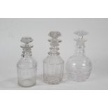 Three 19th Century glass decanters, one with a leaf design, another with a panel design and the