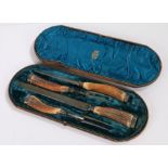 Victorian silver mounted four piece carving set, Sheffield 1891, each with antler handles, housed