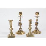 Pair novelty brass candlesticks, each having lion figural columns and raised on circular feet, 19.