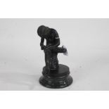 After the antique, bronzed model of Spinario, Boy with Thorn, raised on a circular marble base (AF),