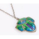 Silver necklace in the form of a shield with green and blue enamel