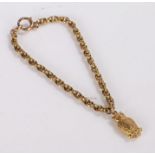 9 carat gold owl charm, attached to a yellow metal chain, gross weight 4.9 grams