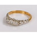 18 carat gold and platinum ring set with three small diamonds, ring size L, 2.8g
