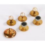 Three 9 carat gold pearl set button studs, 2.8 grams gross, together with two plated studs and an 18