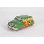 Mettoy clockwork tin plate toy car, Woody Wagon, the green roof above yellow and wood effect